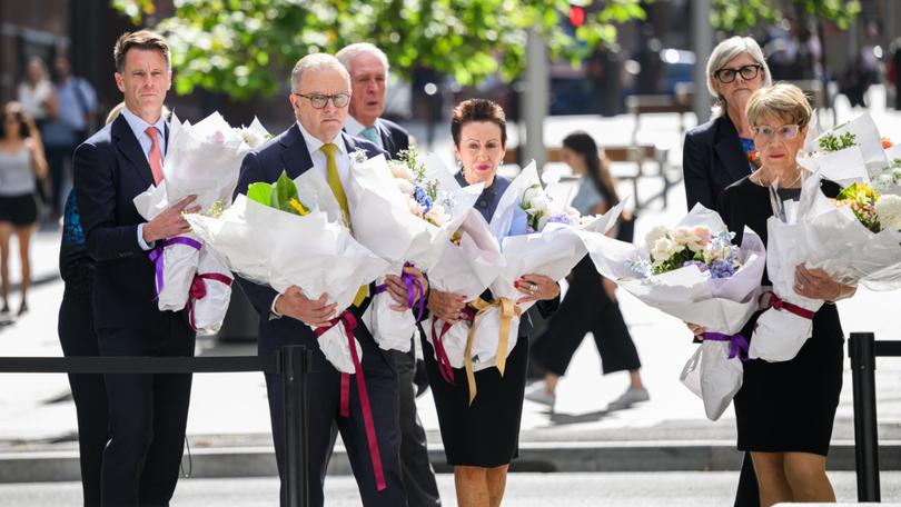 Ten years on from the ‘traumatising’ Lindt Cafe siege that killed two people and terrorised Sydney, Prime Minister Anthony Albanese and Premier Chris Minns have led floral tributes in Martin Place.