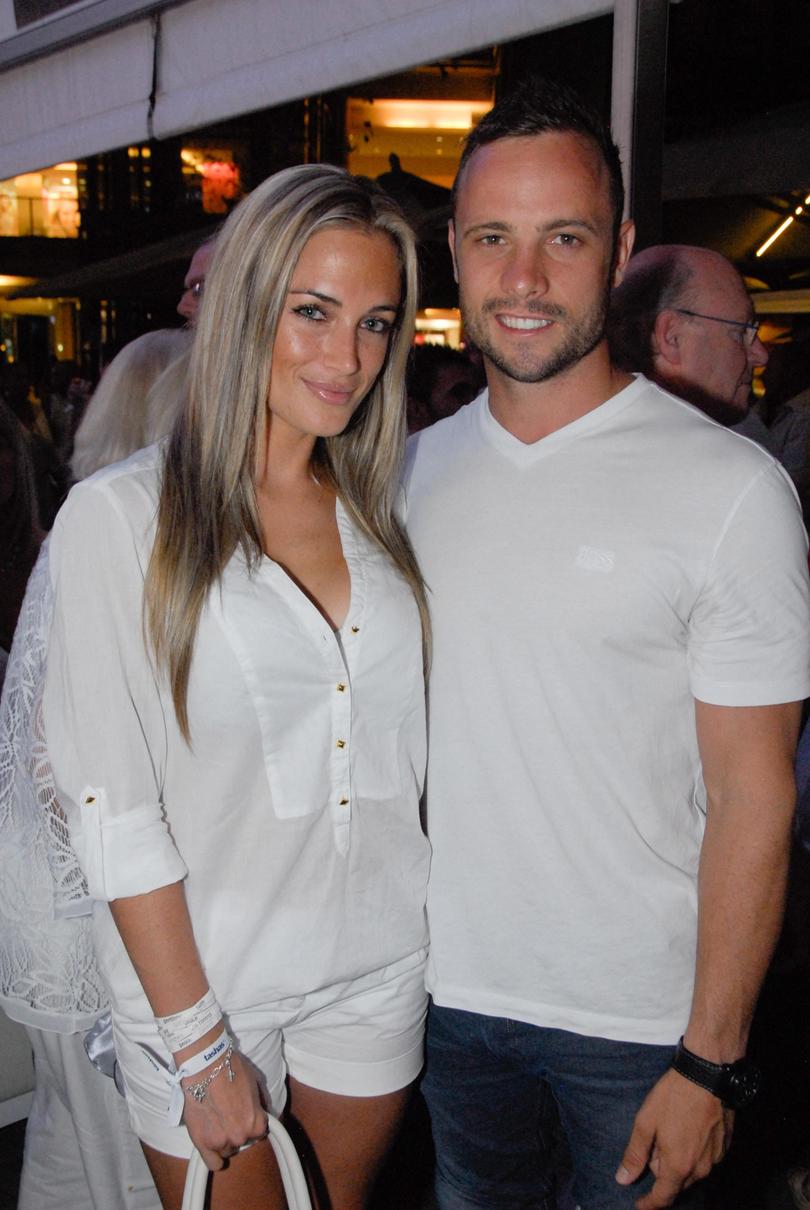 Oscar Pistorius posing next to girlfriend Reeva Steenkamp, who he later murdered.