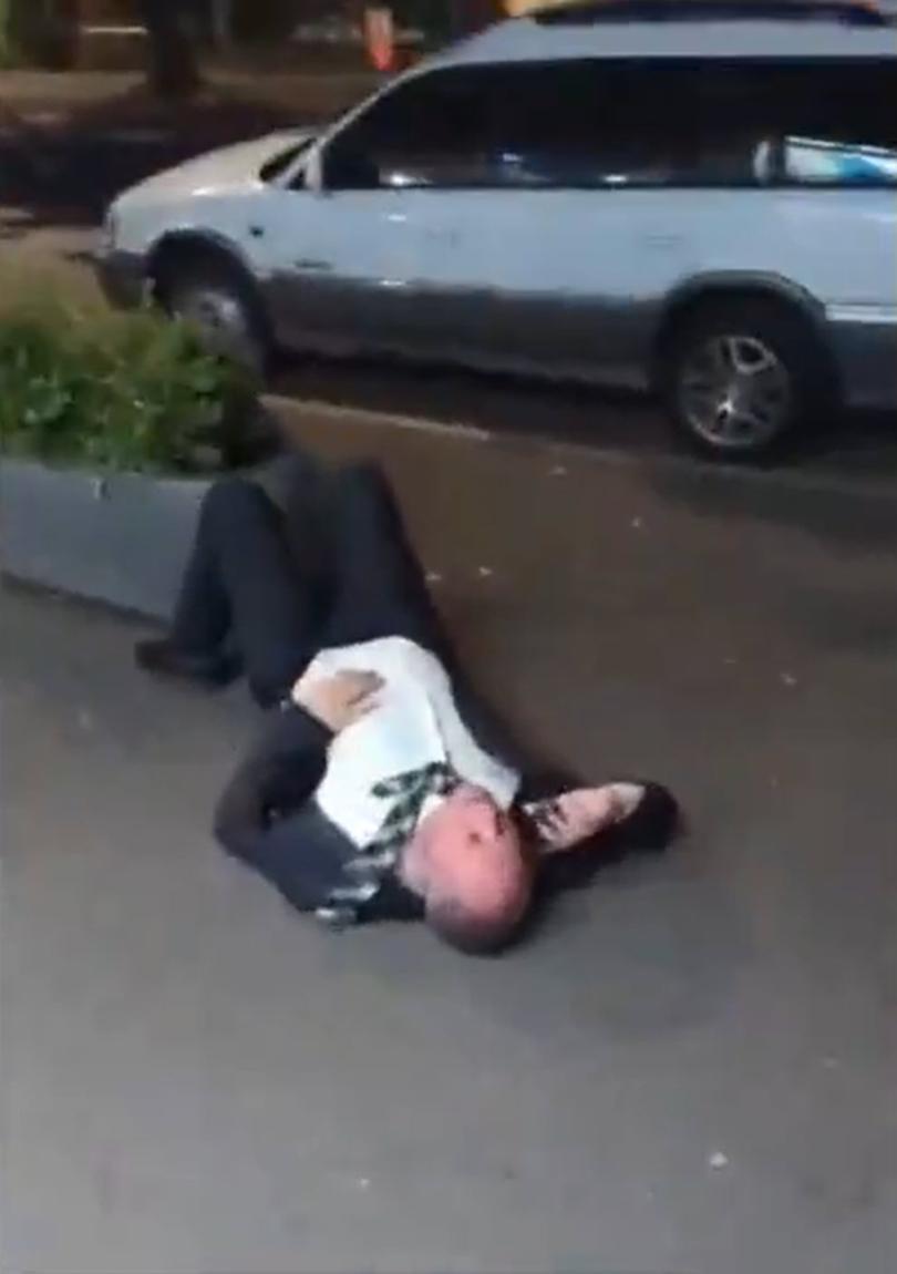 Barnaby Joyce is seen lying on the side of the road in Braddon, Canberra