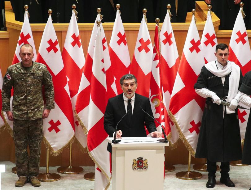 Mikheil Kavelashvili, elected by lawmakers as Georgia's new President, takes the oath during his swearing-in ceremony at the parliament in Tbilisi, on December 29, 2024. 