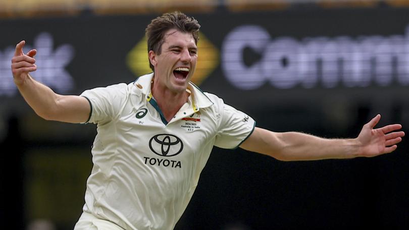 Australia's captain Pat Cummins celebrates the wicket of India's Nitish Kumar Reddy.