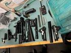 Police took possession of multiple firearms during the search and seizure.