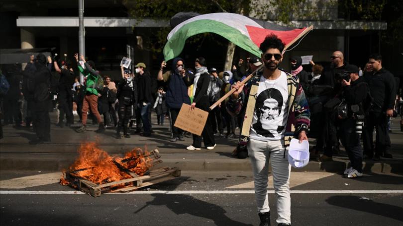 The crackdown includes a ban on flags of listed terrorist organisations. (Joel Carrett/AAP PHOTOS)