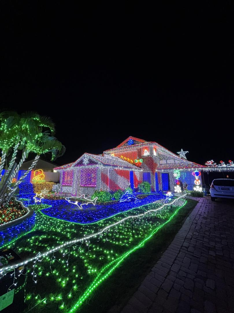 You won’t see anything else like 71 McPherson Road, Sinnamon Park, the owners have — literally — draped the entirety of their roof and walls with lights.