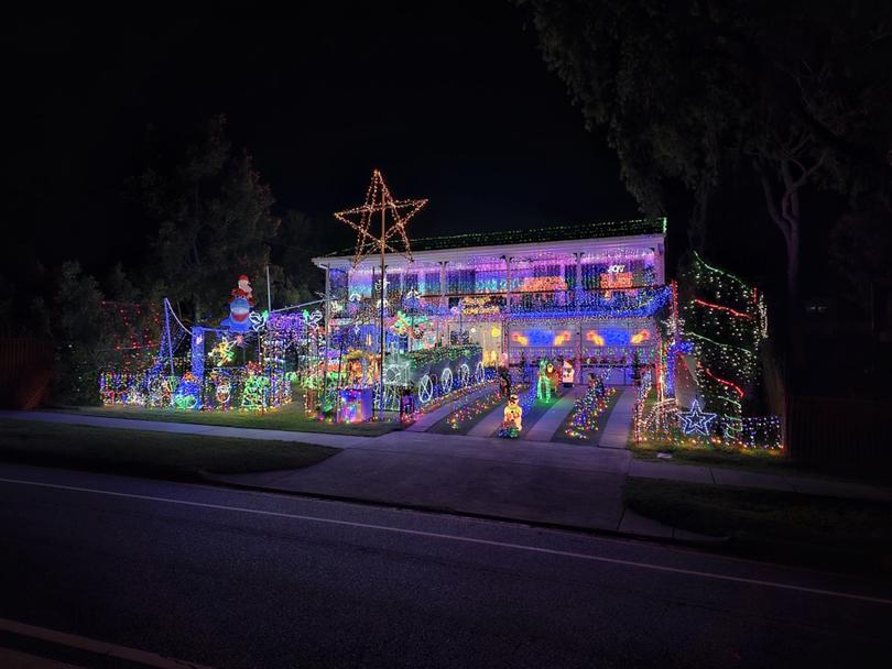 An insane 401,350 lights (yes, they counted every one!), accumulated from over 23 years of decorating, occupy the property here at 20 Curragundi Road, Jindalee, says Kennedy.