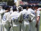 Indian players huddle before the start of the play on day two of the second cricket test match between Australia and India at the Adelaide Oval in Adelaide, Australia, Saturday, Dec. 7, 2024. (AP Photo/James Elsby)