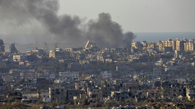 Smoke rises following an explosion in the Gaza Strip as seen from southern Israel, Wednesday, Dec.18, 2024. 