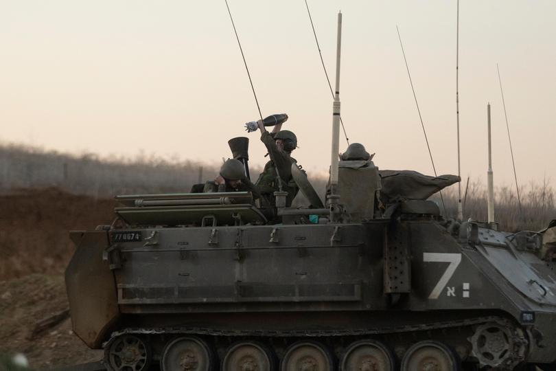 Israeli soldiers fire a mortar shell towards the Gaza Strip on December 18, 2024 in Southern Israel.