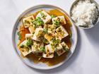 FILE — Silken tofu with spicy soy dressing in New York in August 2021. When even thinking about cooking is a slog, Hetty McKinnon’s recipe, inspired by Japanese hiyayakko and Chinese liangban tofu, is the ultimate dish. Food styled by Simon Andrews. (Chris Simpson/The New York Times)