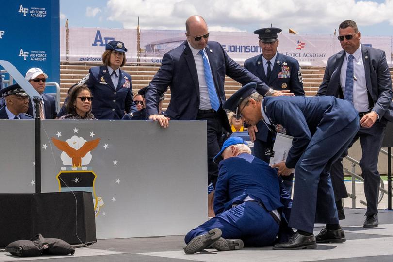 President Joe Biden falls on stage during a 2023 United States Air Force Academy Graduation Ceremony in Colorado Springs.