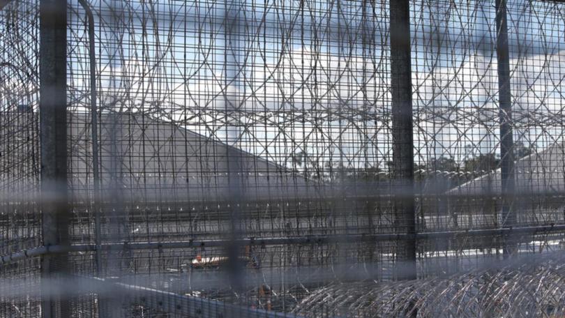 An ambushed prison guard was left with chemical burns, a punctured lung and stab wounds. (Jono Searle/AAP PHOTOS)