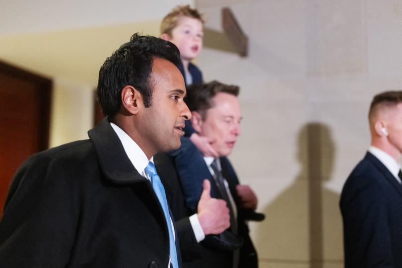 Vivek Ramaswamy, left, and Elon Musk, with his son X, depart the Capitol building in Washington on Dec. 5.