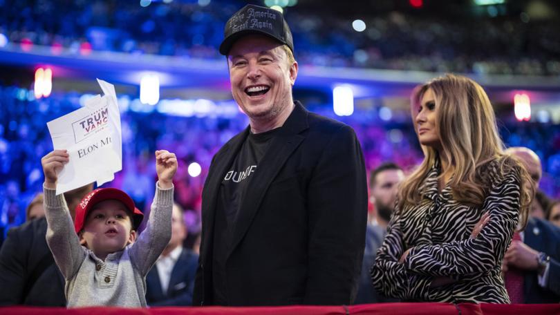 Elon Musk and former first lady Melania Trump listen as Republican Donald Trump speaks at a campaign rally in October. 