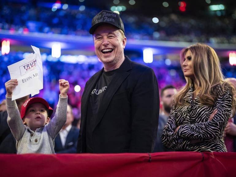 Elon Musk and former first lady Melania Trump listen as Republican Donald Trump speaks at a campaign rally in October. 