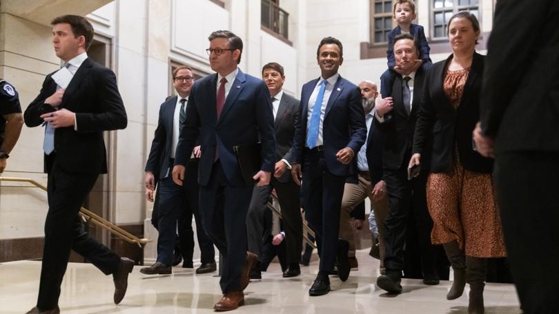 From left, House Speaker Mike Johnson, Vivek Ramaswamy and Elon Musk walk through Capitol Hill on Dec. 5. MUST CREDIT: Craig Hudson for The Washington Post