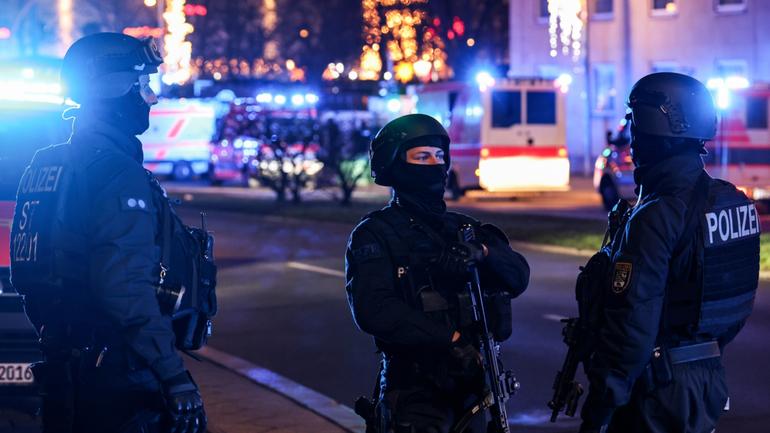 Special police officers at the scene after at least two people were killed at the Christmas market in Magdeburg, Germany.