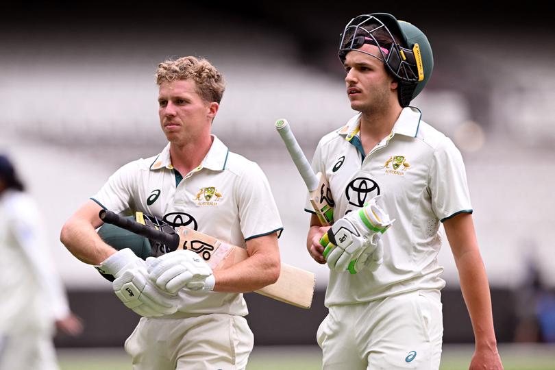 Australian batsmen Nathan McSweeney (L) and Sam Konstas (R) walk off at tea on the third day of the Australia A against India A cricket match.