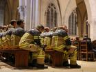 21 December 2024, Saxony-Anhalt, Magdeburg: Firefighters attend the memorial service for the victims of Magdeburg's Christmas market attack, at Magdeburg's Cathedral. Hundreds of people, including from the far right, gathered in Magdeburg on Saturday evening following the deadly car-ramming attack at a Christmas market in the central German city that left at least five dead and 200 injured. Photo: Jan Woitas/dpa