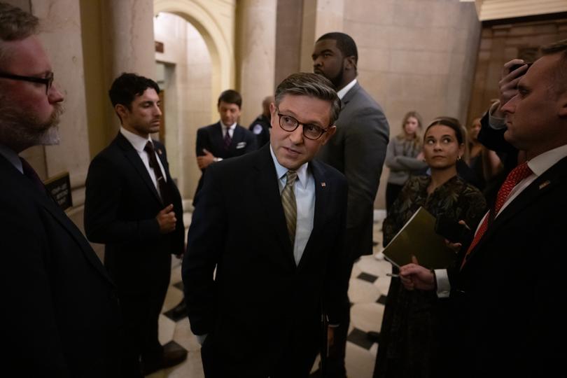 House Speaker Mike Johnson (R-Louisiana) speaks to reporters outside of his office Friday after the House passed a bill to avert a government shutdown.