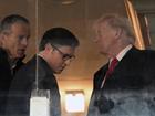 President-elect Donald Trump, right, talks with Sen. John Thune (R-South Dakota) and House Speaker Mike Johnson during the Army-Navy football game.