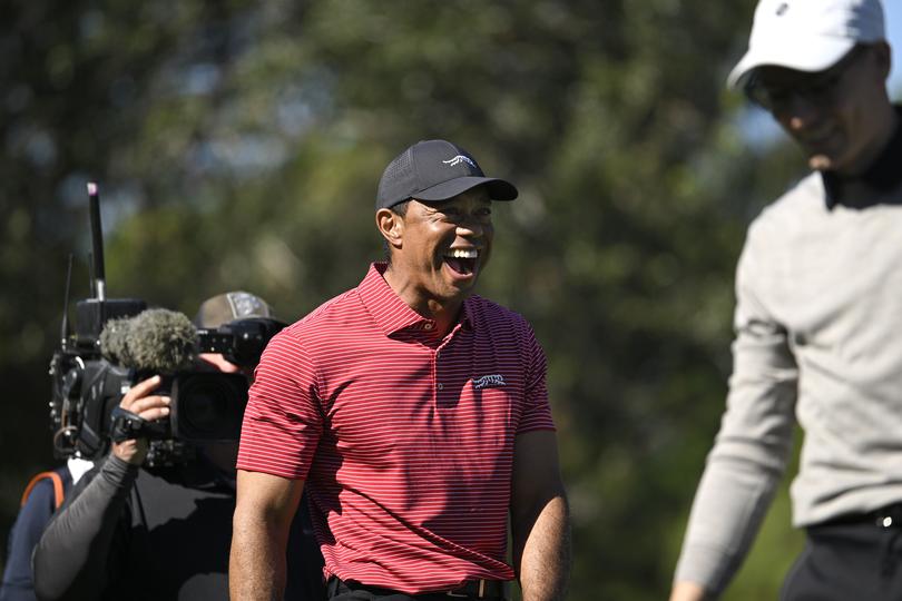 Tiger Woods, center, reacts to his son Charlie Wood's hole-in-one on the fourth hole during the final round of the PNC Championship.