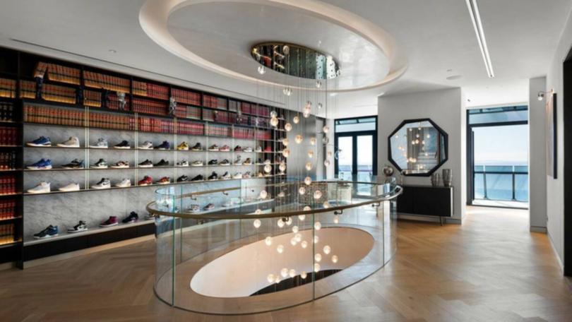 The shoe display wall in Simon and Tah-nee Beard’s luxe apartment.