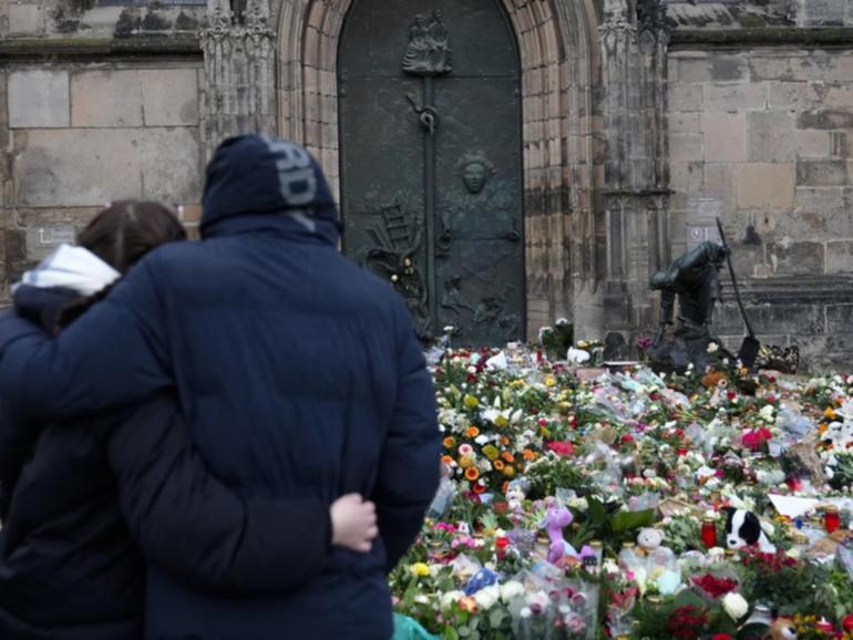 Germany remains in shock and mourning two days after the deadly attack on a Christmas market. (AP PHOTO)