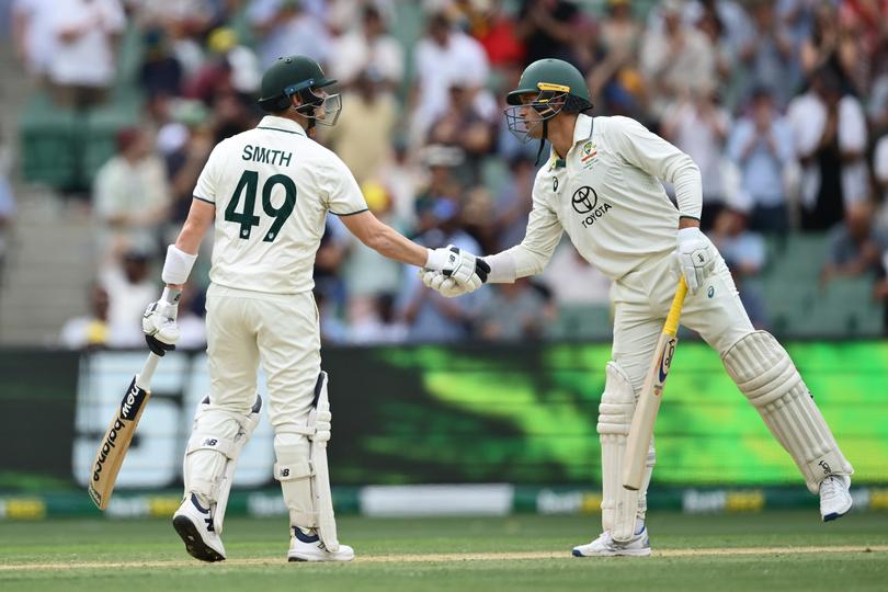 MELBOURNE, AUSTRALIA - DECEMBER 26: Steve Smith of Australia is congratulated by Alex Carey of Australia after reaching his half century during day one of the Men's Fourth Test Match in the series between Australia and India at Melbourne Cricket Ground on December 26, 2024 in Melbourne, Australia. (Photo by Quinn Rooney/Getty Images)