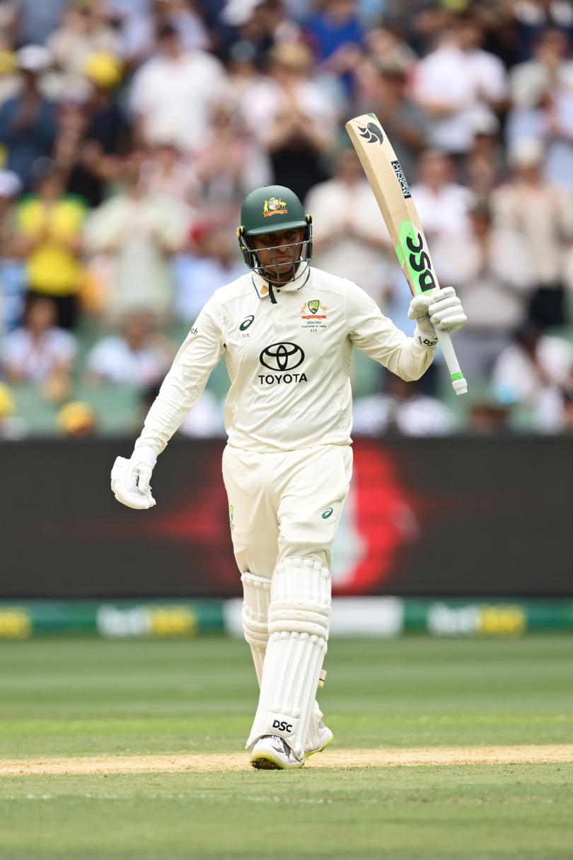 MELBOURNE, AUSTRALIA - DECEMBER 26: Usman Khawaja of Australia celebrates after reaching is half century during day one of the Men's Fourth Test Match in the series between Australia and India at Melbourne Cricket Ground on December 26, 2024 in Melbourne, Australia. (Photo by Quinn Rooney/Getty Images)