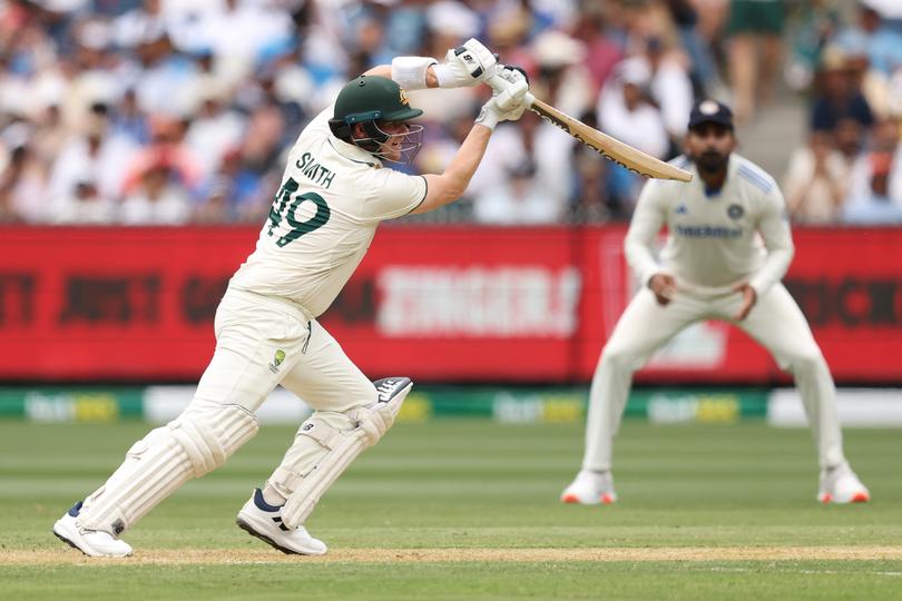 MELBOURNE, AUSTRALIA - DECEMBER 26: Steve Smith of Australia plays a shot during day one of the Men's Fourth Test Match in the series between Australia and India at Melbourne Cricket Ground on December 26, 2024 in Melbourne, Australia. (Photo by Robert Cianflone/Getty Images)