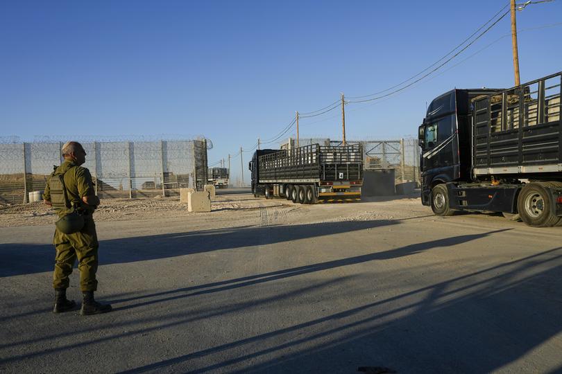 Trucks carrying humanitarian aid cross into the Gaza Strip from Erez crossing in southern Israel.