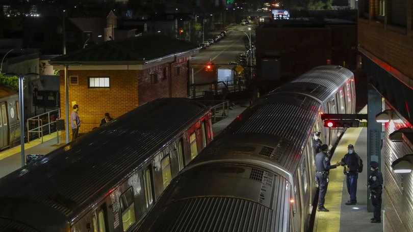 A man has been arrested on suspicion of murder after a woman was burned to death on a subway train.