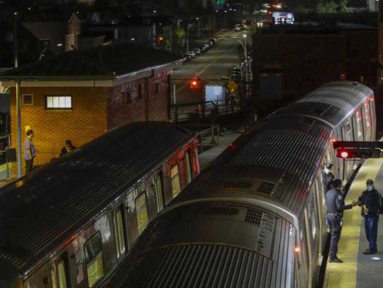 A man has been arrested on suspicion of murder after a woman was burned to death on a subway train.