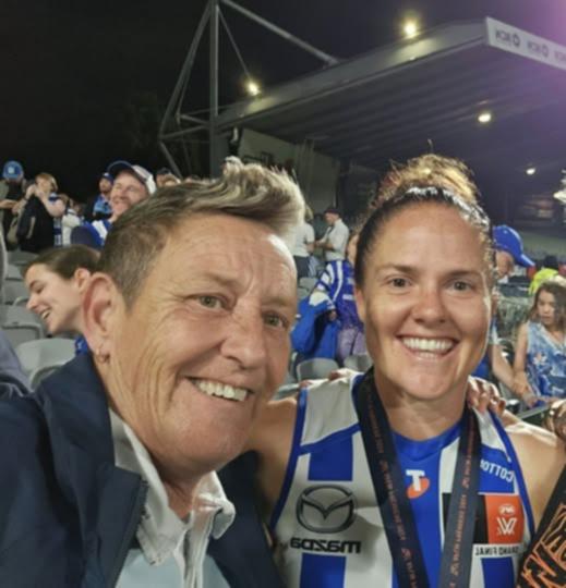 Sal Rees with North Melbourne captain Emma Kearney after last month’s AFLW premiership. 