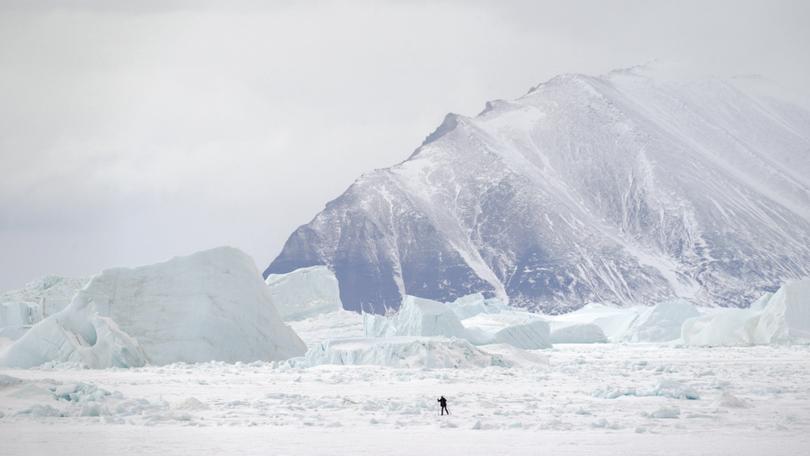 A skier crosses sea ice in Qaanaaq in 2023. (MUST CREDIT: Bonnie Jo Mount/The Washington Post)