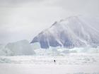 A skier crosses sea ice in Qaanaaq in 2023. (MUST CREDIT: Bonnie Jo Mount/The Washington Post)