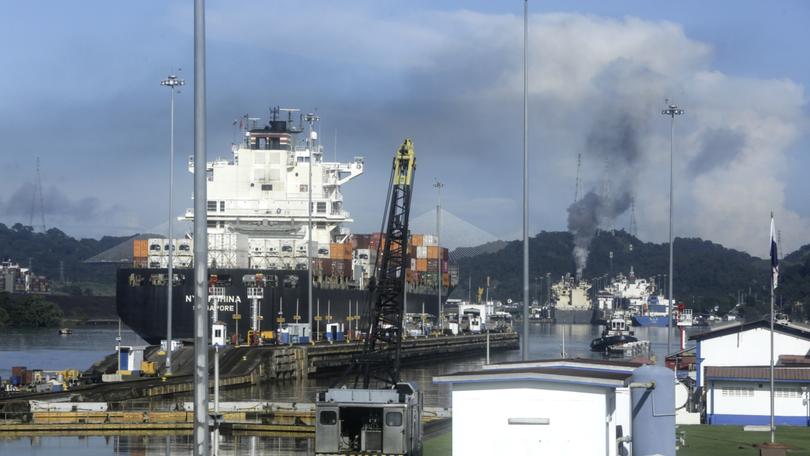 A ship passes through Miraflores locks of the Panama Canal.