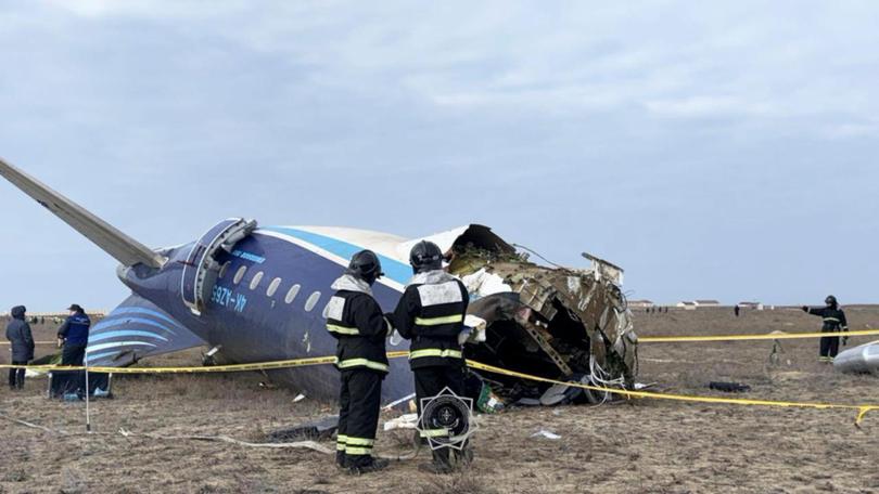 epa11792901 A handout photo made available by the press service of the Ministry for Emergency Situations of Kazakhstan shows emergency specialists working at the crash site of a passenger plane near Aktau, Kazakhstan, 25 December 2024. Azerbaijan Airlines Embraer ERJ-190AR passenger plane flying from Baku to Grozny crashed some three kilometres away from the city of Aktau. According to preliminary information, the incident was caused by a collision between the aircraft and a flock of birds. EPA/KAZAKHSTAN EMERGENCIES MINISTRY HANDOUT -- BEST QUALITY AVAILABLE -- MANDATORY CREDIT -- HANDOUT EDITORIAL USE ONLY/NO SALES KAZAKHSTAN EMERGENCIES MINISTRY HANDOUT