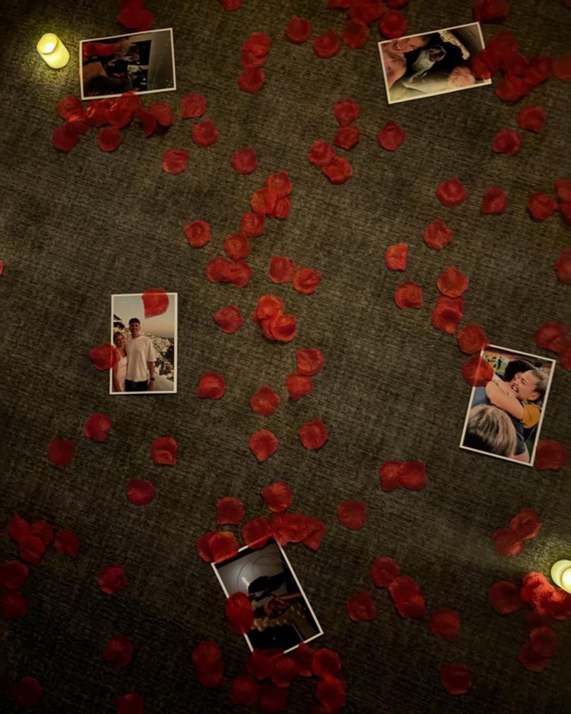 Rose petals and photos featured in the proposal. 