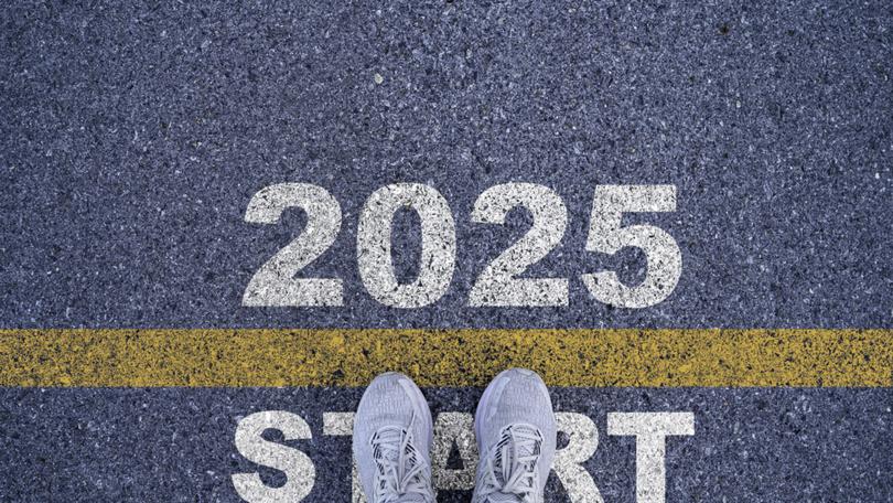 Runner standing at the starting point with 2025 year for starting in new year 2025 to achieve business planing and success concept.