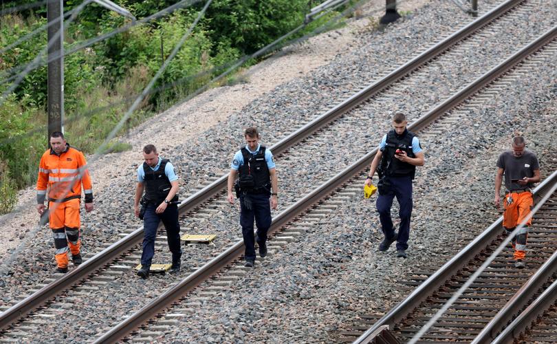 FILE - Emergency services inspected the track after the drivers death. 