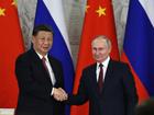 Vladimir Putin and Xi Jinping have joined forces to oppose US policy. (AP PHOTO)