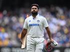 Rishabh Pant of India exits the field after being dismissed.