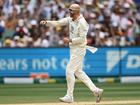 Nathan Lyon celebrates the wicket of Ravindra Jadeja on day three. 