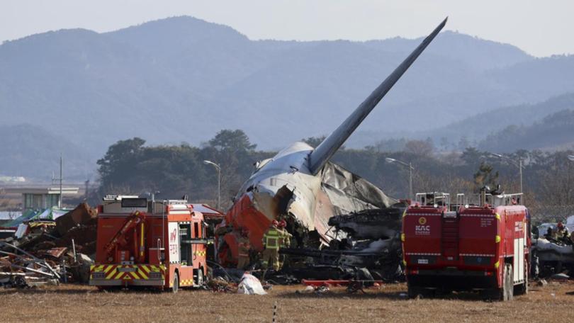 Fire crews and rescue workers rushed to the crash scene at South Korea's Muan International Airport. (AP PHOTO)