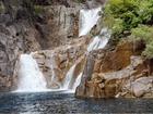 A man has died after falling from a waterfall at Behana Gorge in Aloomba, Queensland.