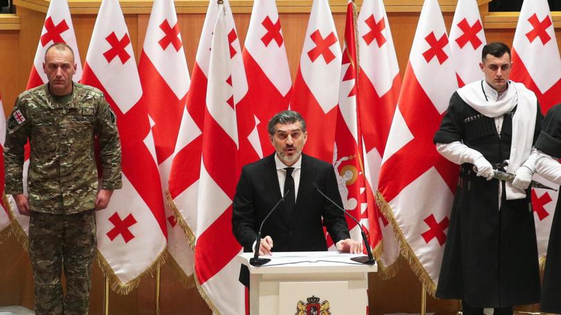 Mikheil Kavelashvili takes the oath during his swearing-in ceremony at the parliament in Tbilisi.