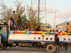 Ethiopians regularly hire cheap trucks instead of buses to transport people to social events.