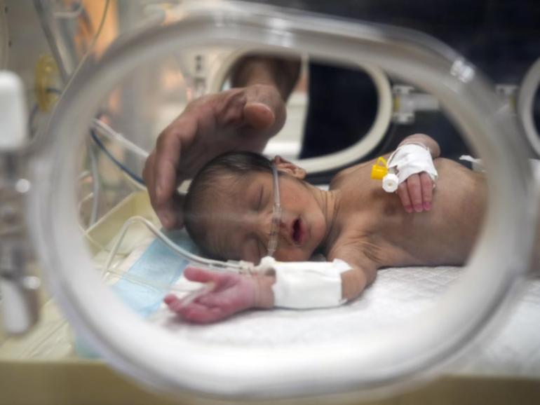 Twenty-day old Ali al-Batran is fighting for life and his twin brother froze to death in Gaza.