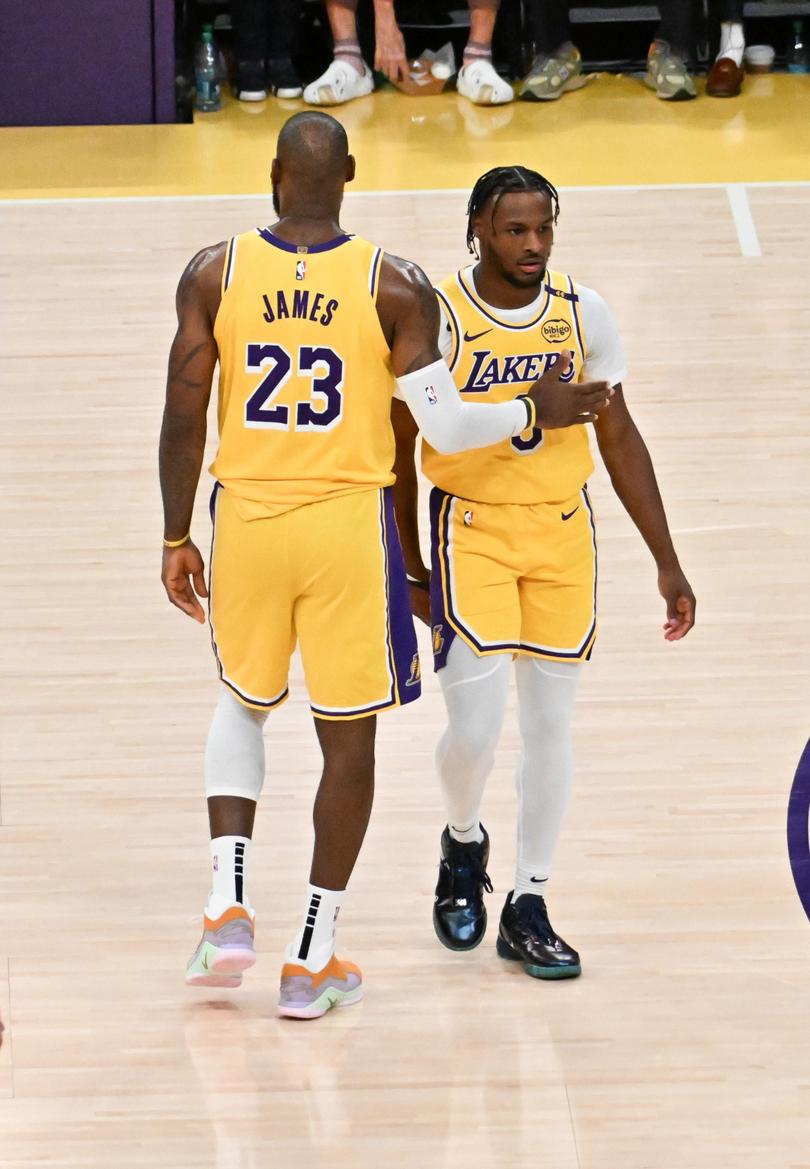 LOS ANGELES, CALIFORNIA - OCTOBER 22: LeBron James #23 and Bronny James #9 of the Los Angeles Lakers on the court for the first time during the game against the Minnesota Timberwolves at Crypto.com Arena on October 22, . 